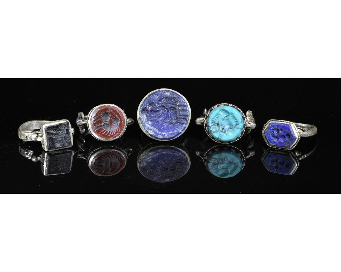 COLLECTION OF MIDDLE EASTERN TRIBAL INTAGLIO RINGS: Ca.19TH - 20TH C AD. Wearable collection of Post Medieval Tribal / Yemeni white metal intaglio rings with multiple depictions and different types of gemstones. Fine Condition; D:18-20mm/L:28-32mm0.71-