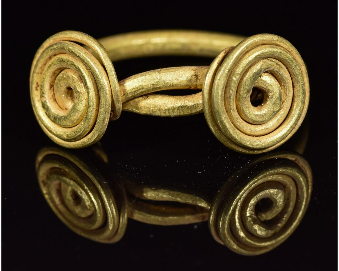 VIKING GOLD COILED RING: Ca.900 AD. An exceptional Celtic D-section gold penannular hoop with round-section coiled terminals. Fine condition; wearable Reference for Viking Jewellery: Cf. Arbman, H. Birka I: Die Gräber, Uppsa