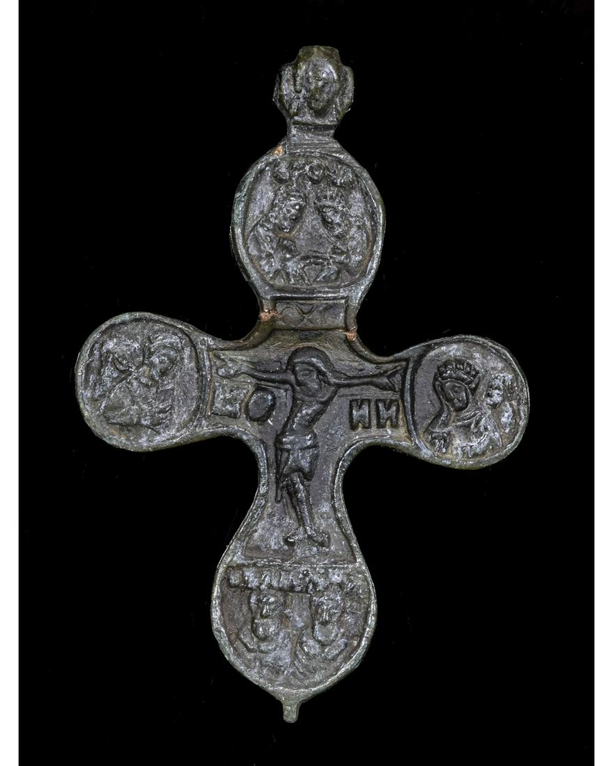 MEDIEVAL BRONZE CROSS PENDANT: Ca.1300-1500 AD. Crusaders period bronze cross; applied suspension loop depicting God; front side depicting crucified Jesus Christ surrounded by saints; reverse part depicting John the Baptist; Good w