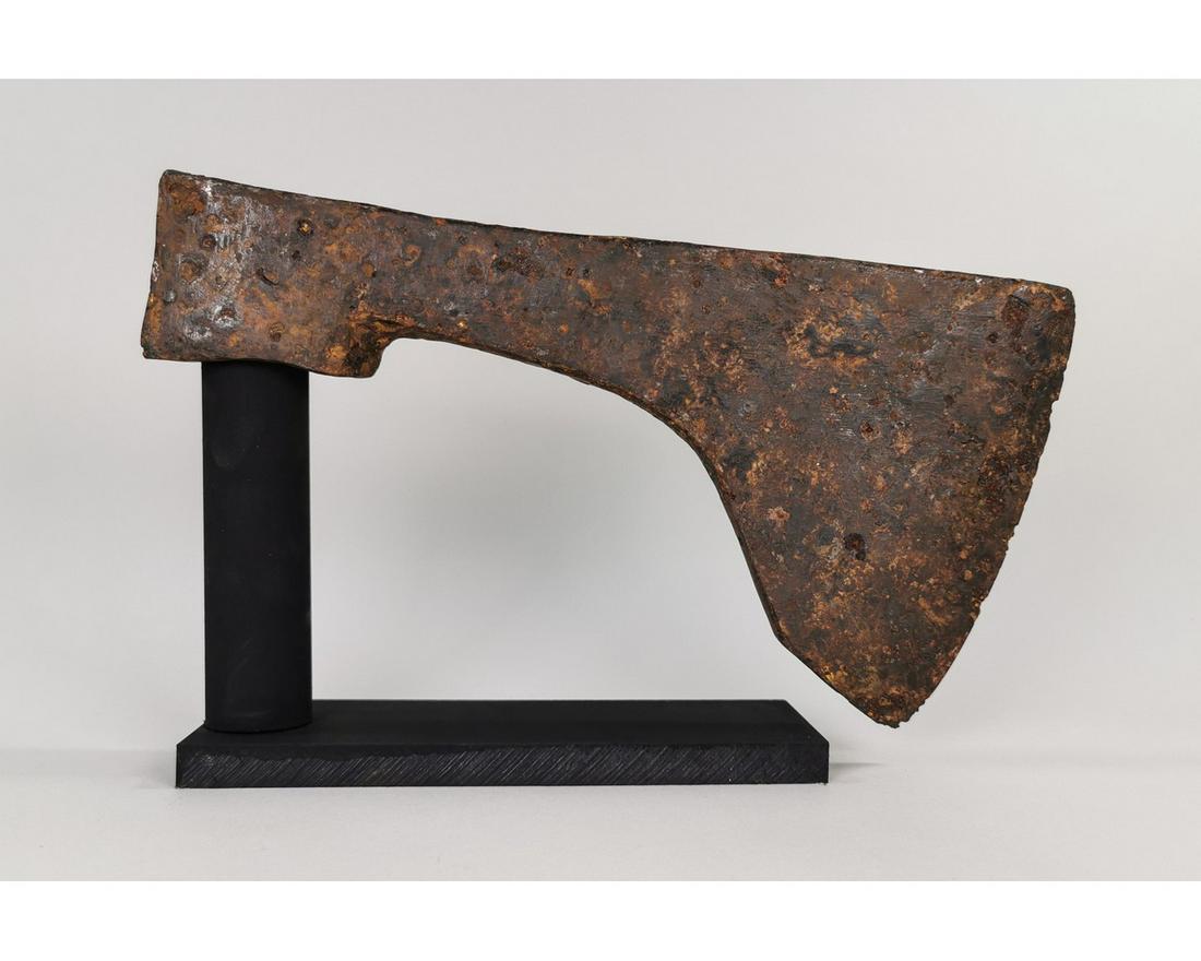 MASSIVE VIKING IRON BATTLE AXEHEAD: Ca. 900 AD. Rare and very large Medieval Scandinavian Iron Axe head; broad curved blade; Good condition; on a custom-made stand; 265 x 140 mm; 10.43305x5.5118 in; 1810g; Provenance: Important estate c