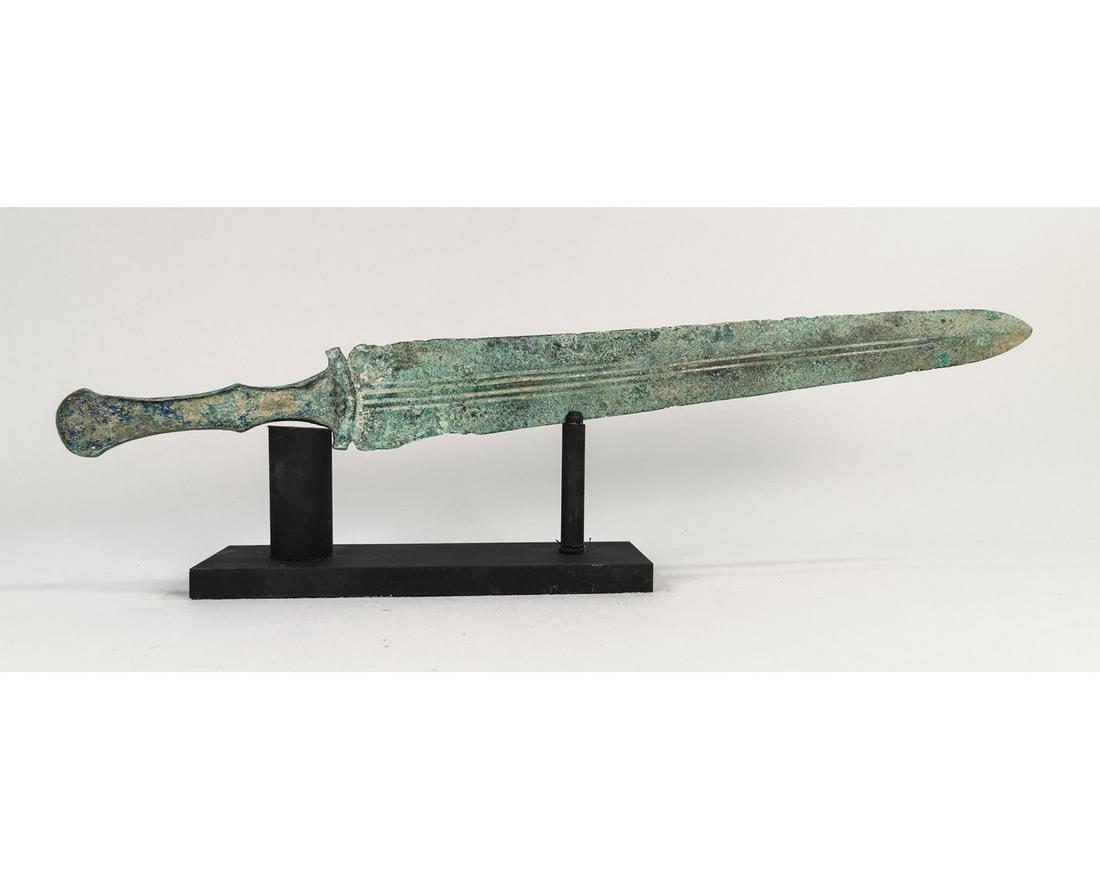 ANCIENT BRONZE SWORD WITH HANDLE: Ca. 1200 BC. Bronze Age, Luristan, decorated short sword with intact handle. A fine example of a lost wax cast bronze short sword with a narrow handle designed to have an inlaid bone or ivory panel. B