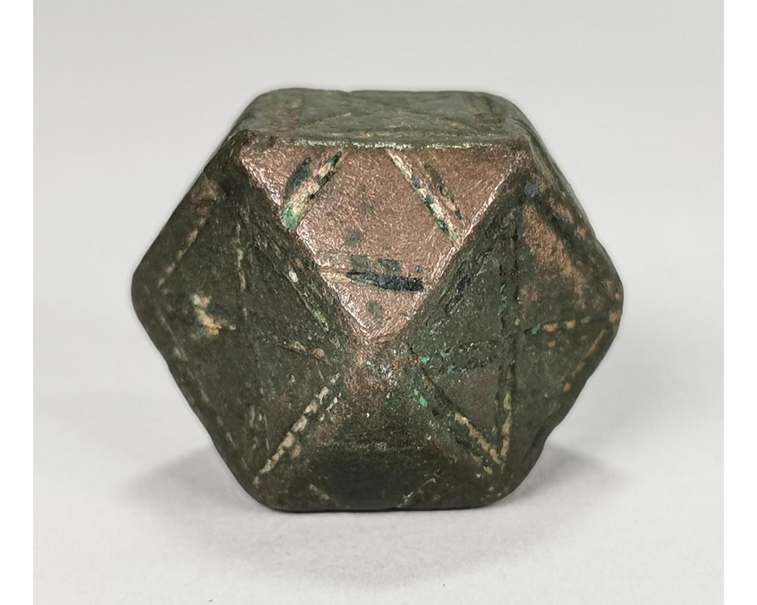 LARGE BYZANTINE BRONZE WEIGHT: Ca.1000 AD. A nice Medieval bronze polyhedral weight with punched pellet, triangle, and other detailing; Good condition; 30 x 30 mm; 1.1811x1.1811 in; 170g; Provenance: From an old British collection,
