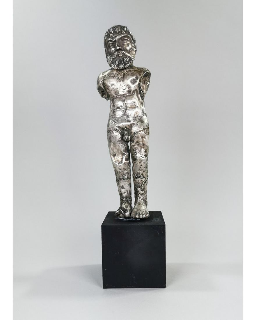 GREEK CLASSICAL PERIOD SILVER ZEUS FIGURINE: Ca.300 BC-100 AD. An extremely rare attractive Greek sheet silver statue of a nude God Zeus, with good facial detail, his hair and beard trimmed and muscular body; Zeus is the Olympian god of the sky 
