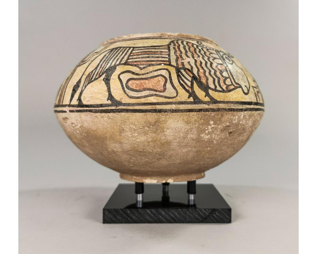 INDUS VALLEY TERRACOTTA VESSEL WITH ANIMALS: Ancient Central Asia, Indus Valley, ca. 3rd millennium BCE. An interesting Polychrome terracotta storage jar, decorated with zebu bull and lion. Reference for Indus Valley Pots: Satyawadi, N. Proto-Hi