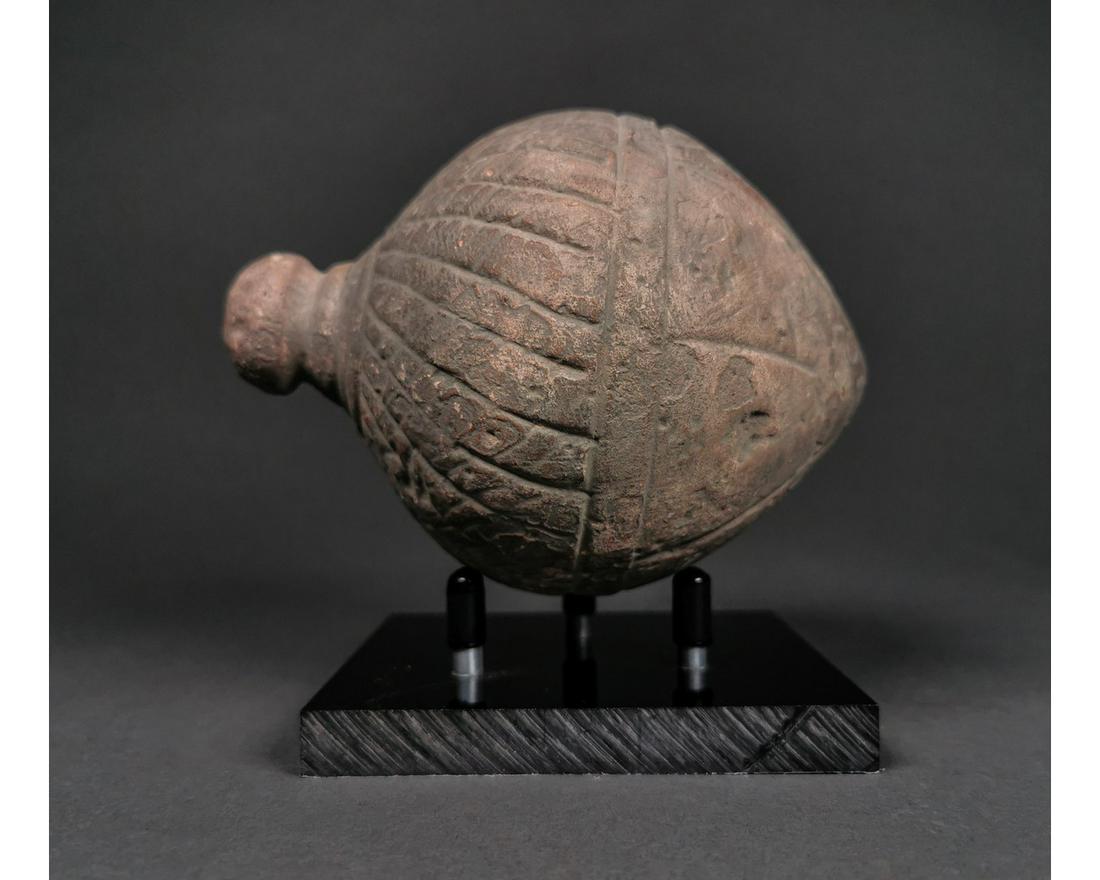 ANCIENT "GREEK FIRE" CERAMIC GRENADE: Ca.800 AD. A hollow ceramic Vessel with a barrel-shaped body, domed top, and conical base, knop to the upper face for the mouth; Good Condition; Size:140mmx95;428g Provenance: From an old British coll