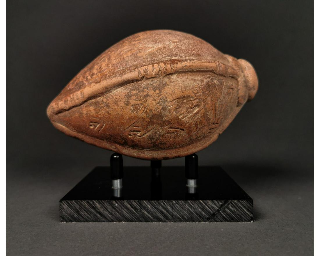 ANCIENT "GREEK FIRE" CERAMIC GRENADE: Ca.800 AD. A hollow ceramic Vessel with a barrel-shaped body, domed top, and conical base, knop to the upper face for the mouth; Good Condition; Size:145mmx80mm;400g;Provenance: From an old British co