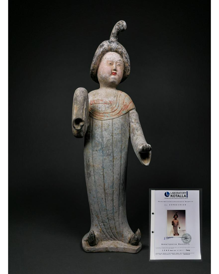 LARGE TANG DYNASTY TERRACOTTA FAT LADY - TL TESTED.: Ca. 618-906 AD; Tang Dynasty. A ceramic figure of a lady in floor-length courtly dress with left hand exposed and right hand held within the sleeve; pink and green pigment. FULLY AUTHENTICATED BY RALF
