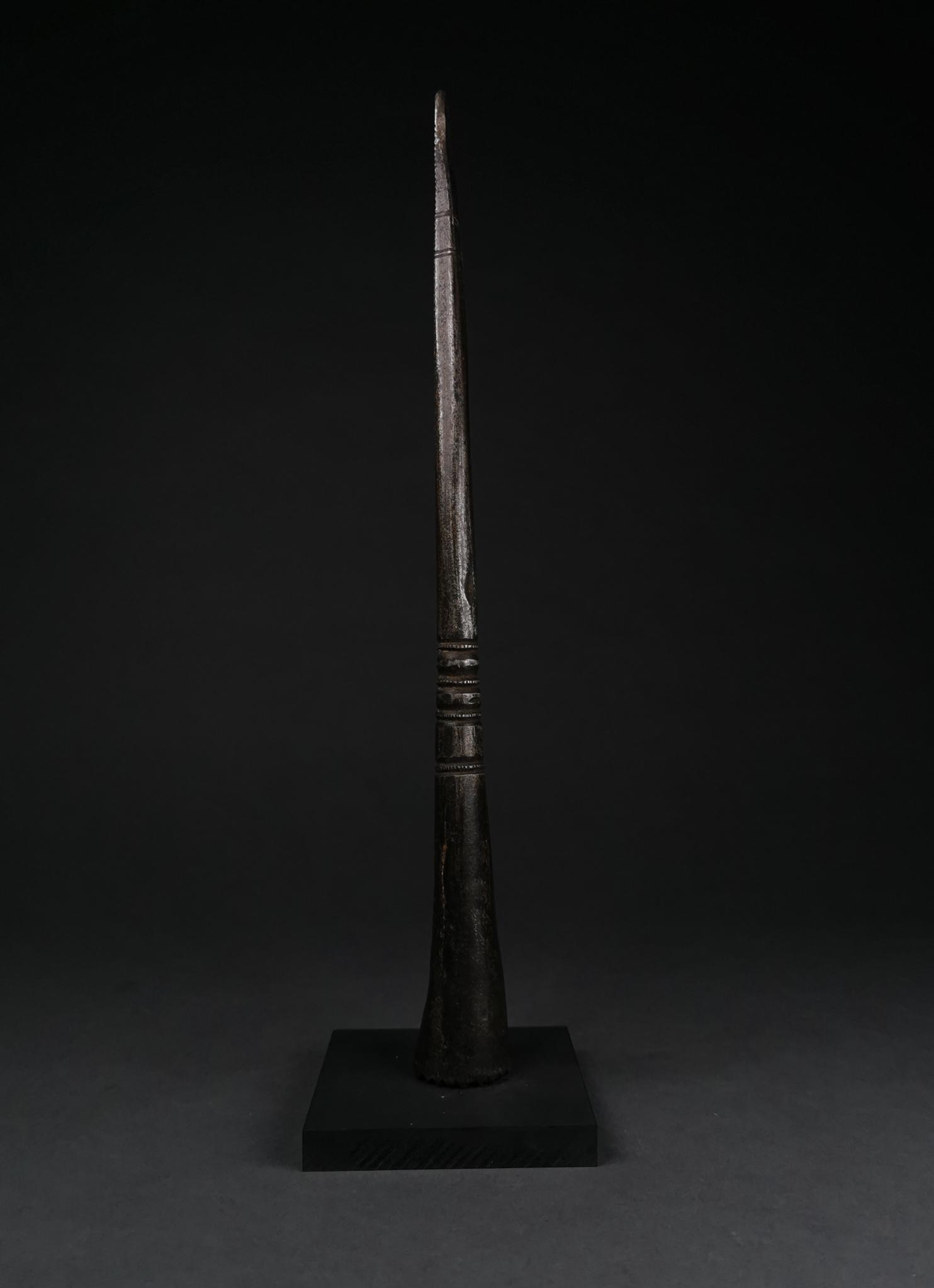 SUPERB MEDIEVAL SOCKETED SPEAR: c. 1400 AD, Medieval Persian. This beautiful iron spearhead comprises a wedge-shaped blade with incised linear and curvilinear decorations, a round neck with linear decorations which transitions into 