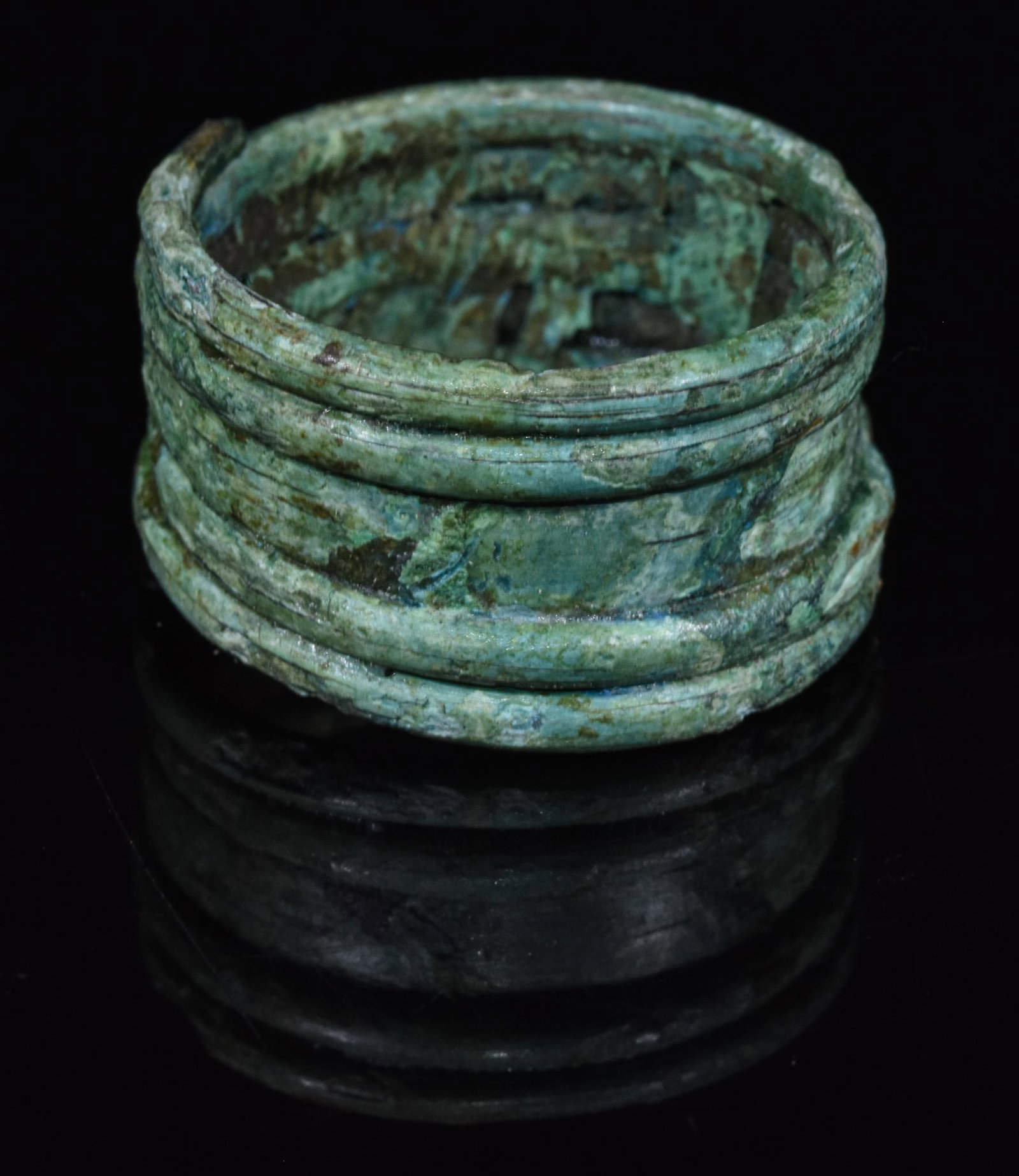 VIKING COILED BRONZE "SNAKE" RING: 700-1100 AD, Viking Age. A nice bronze coiled ring, intended to evoke the form of a snake. In Norse mythology, Jormungand (pronounced “YOUR-mun-gand;” Old Norse Jörmungandr, “Great Beast”), a