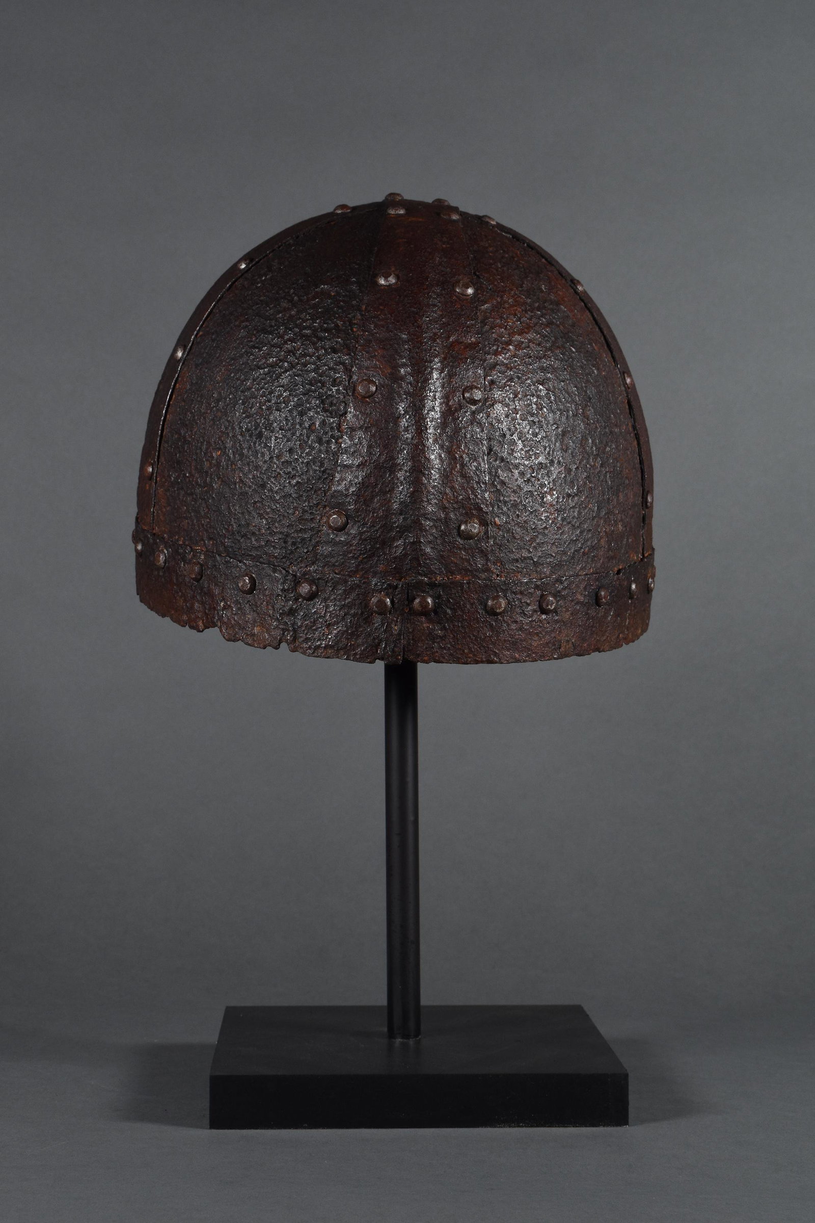 VIKING FOUR-PLATE IRON HELMET: c. 900-1100 AD. Viking age. A wonderful Spangenhelm-style helmet comprising several pieces of iron riveted to form a bowl shape. These helmets were extremely popular during the Viking Age as they were