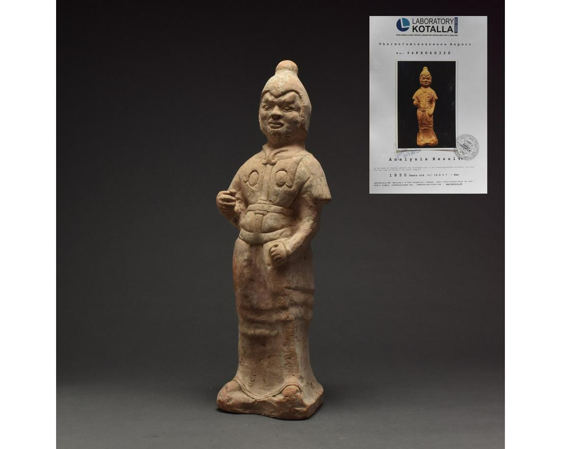 CHINESE HAN DYNASTY TERRACOTTA SOLDIER FIGURE - TL: Ca. 206 BC–220 AD Chinese Han Dynasty, terracotta warrior figure. Interesting ceramic figurine of a standing warrior with armor, cross-over war-coat, layered tunic and boots, dressed hair and hands 