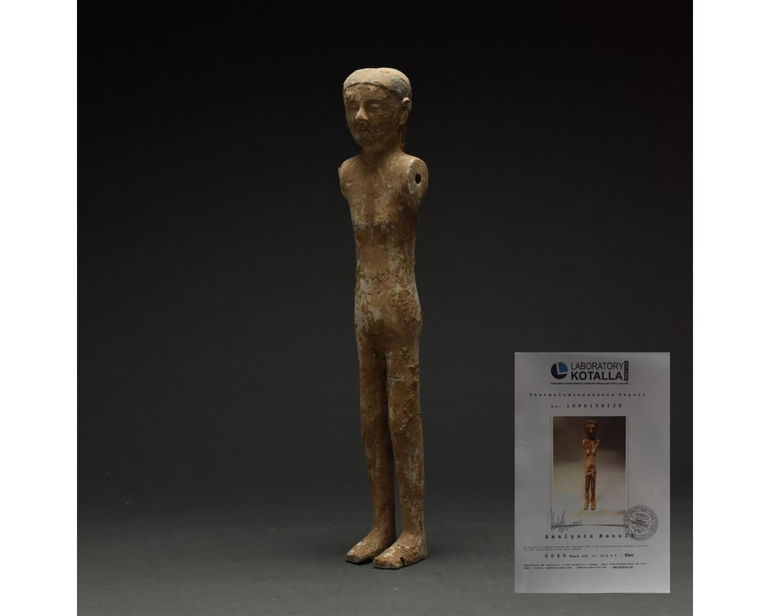 CHINESE HAN DYNASTY TERRACOTTA SOLDIER - TL TESTED: Ca. 206 BC - 220 AD. Han dynasty terracotta soldier figure. A cream-coloured terracotta figure of a standing soldier with elongated legs and torso, stylised facial features, and black hair worn short 