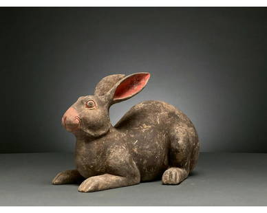 CHINA, HAN DYNASTY POTTERY BLACK RABBIT - TL TESTED: Ca. 206 BC - 220 AD. Han dynasty, A hollow-formed terracotta rabbit figurine with a black pelt and coral-pink pigmentation on the nose and in the inner ears. The rabbit is depicted sitting on all