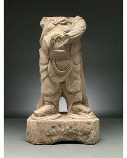 CHINA, MING DYNASTY STONE TORSO OF A WARRIOR: Ca. 1368-1644 AD. Ming Dynasty. A light cream stone torso of a warrior. The heavily-armoured figure stands in a static posture with his legs at shoulder-width apart and one arm raised in front of the