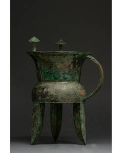 CHINA, SHANG DYNASTY BRONZE RITUAL JIA VESSEL - XRF: 1300-1200 BC. Shang dynasty. A beautiful bronze jia tripod vessel comprising a flaring rim, inward sloping neck, flaring shoulder and flat bottom supported by three wedge-shaped legs. A single strap