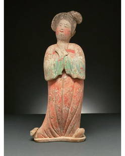 CHINA, TANG DYNANSTY POTTERY COURT LADY - TL TESTED: C. AD 618 and 907. Tang Dynasty. Terracotta full-figured court lady who sways to one side and has her hands clasped at her chest. This female figure is presented wearing court attire, or shenyi,