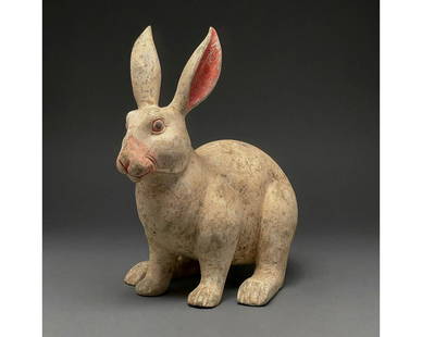 CHINA, HAN DYNASTY POTTERY RABBIT- TL TESTED: Ca. 206 BC - 220 AD. Attractive Han dynasty terracotta rabbit. A hollow-formed terracotta rabbit figurine; with creme pelt and coral-pink pigmentation on the nose. The rabbit is depicted on all fours