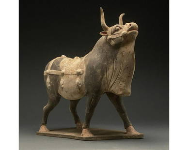 CHINA, NORTHERN WEI POTTERY PAINTED OX - TL TESTED: Ca. 386-534 AD. Chinese Northern WeiDynasty. A beautiful painted terracotta statue of an ox. This black and white painted ox is shown standing, with its head and neck stretching forward, with its