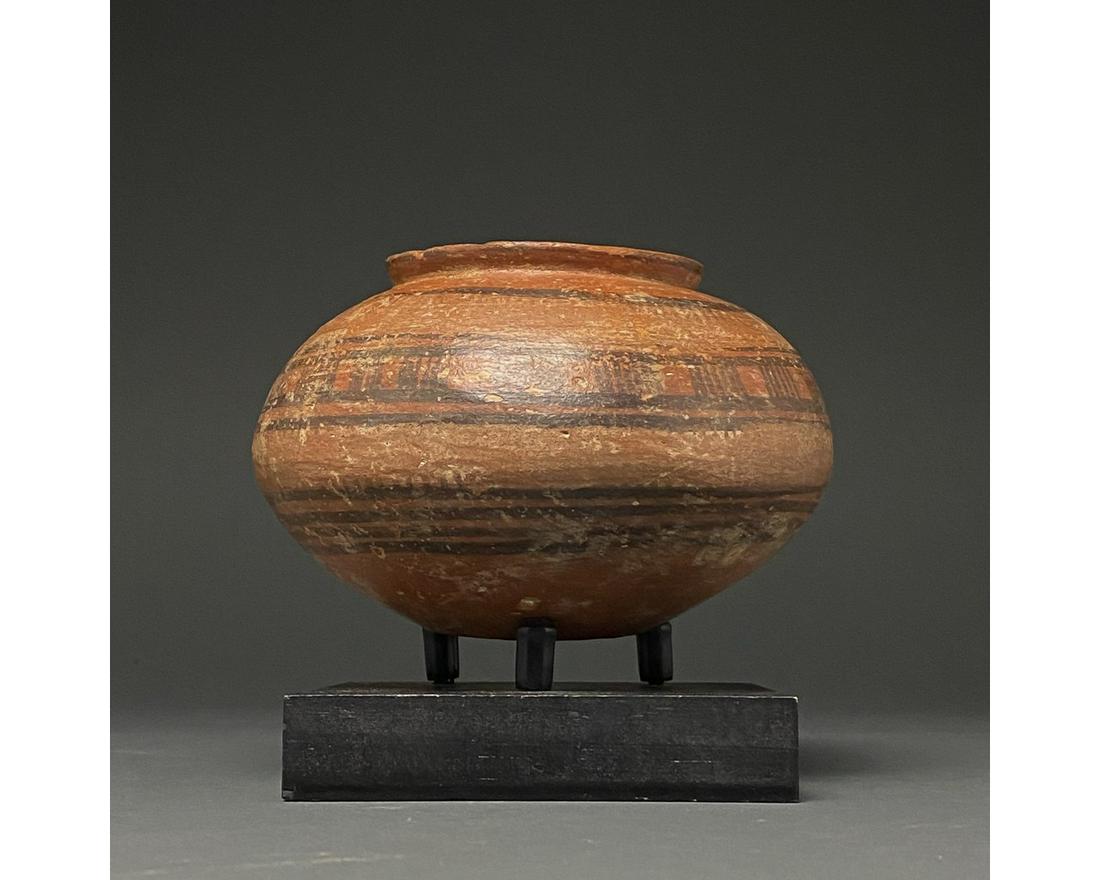 INDUS VALLEY PAINTED POTTERY VESSEL: C. 3rd millennium BC. Ancient Central Asia, Indus Valley. A fine example of an Indus Valley civilisation pot, with globular body a flat, round base and a short, slightly outward flaring rim. This ochr