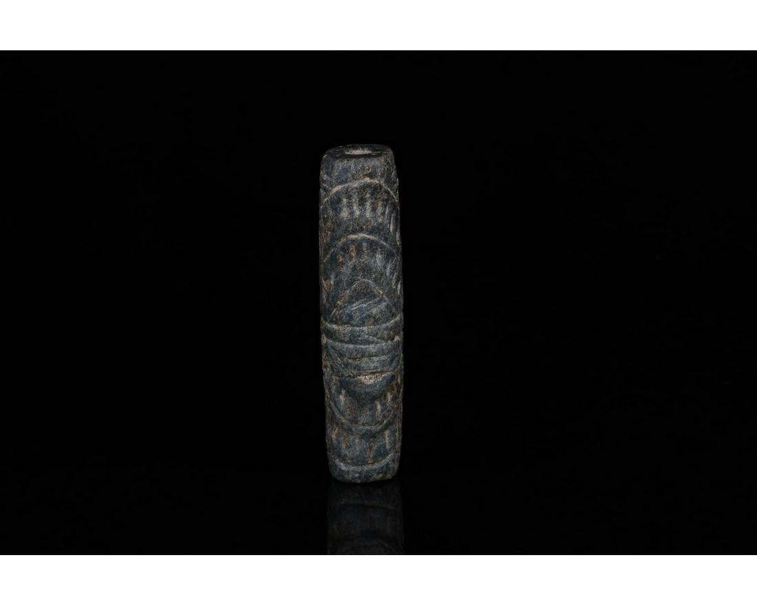 RARE AKKADIAN CYLINDER SEAL - ORIGINAL PAPERWORK: c. 2400-2200 BC. Akkadian. Rare cylinder seal of lapis lazuli. The pattern comprises a central line, surrounded top and bottom by a double chevron pattern. Good condition; comes with original paperwor