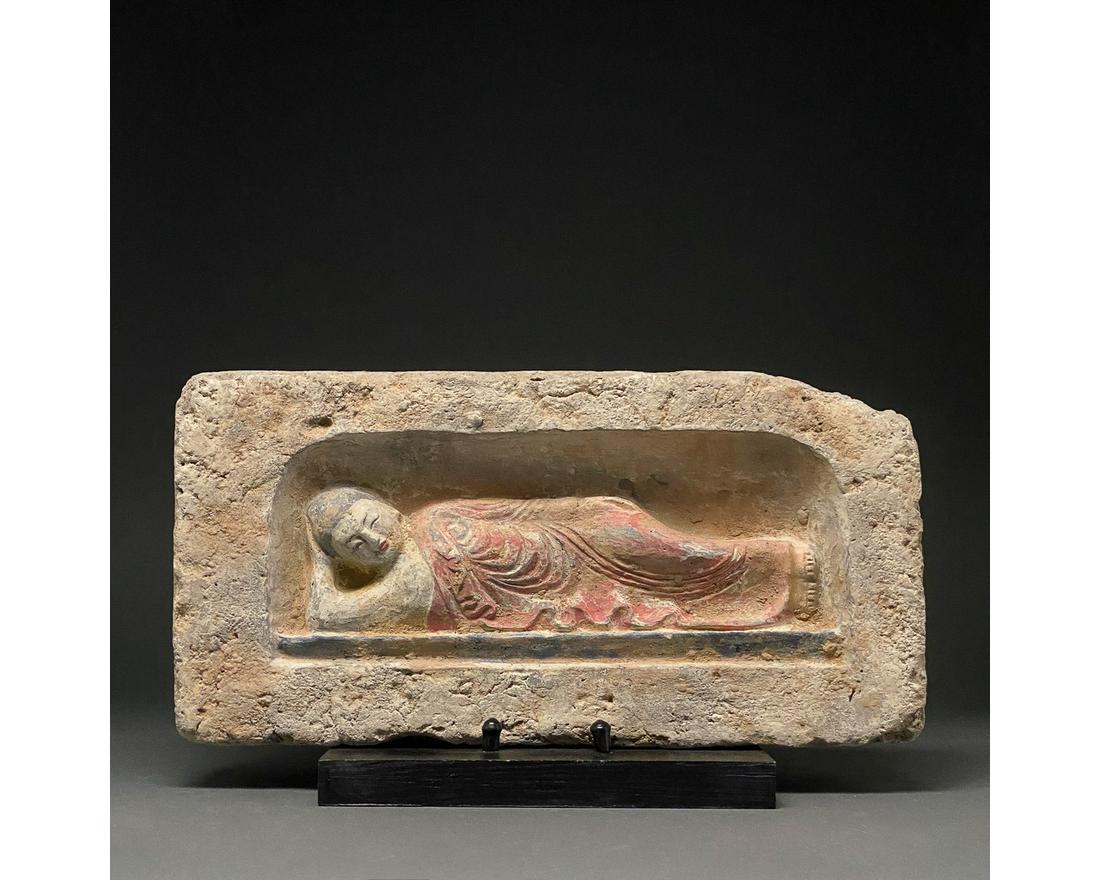CHINA, SONG DYNASTY POTTERY BRICK WITH MUSICIAN: Ca.960-1279 AD. Chinese Song Dynasty. A rectangular, terracotta-coloured brick with a reclining musician within a recess; the figureâ€™s hair is picked out in black and the rich drapery of his(?)