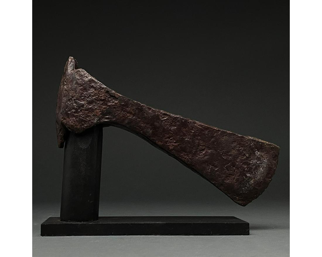 VIKING IRON BATTLE AXE HEAD: c. 900-1100 AD. Viking age. An iron axe head comprising a short, curved blade, elongated cheek, lozenge-shaped poll and rounded socket. The era known as the Viking age lasted for more than 300 years, 