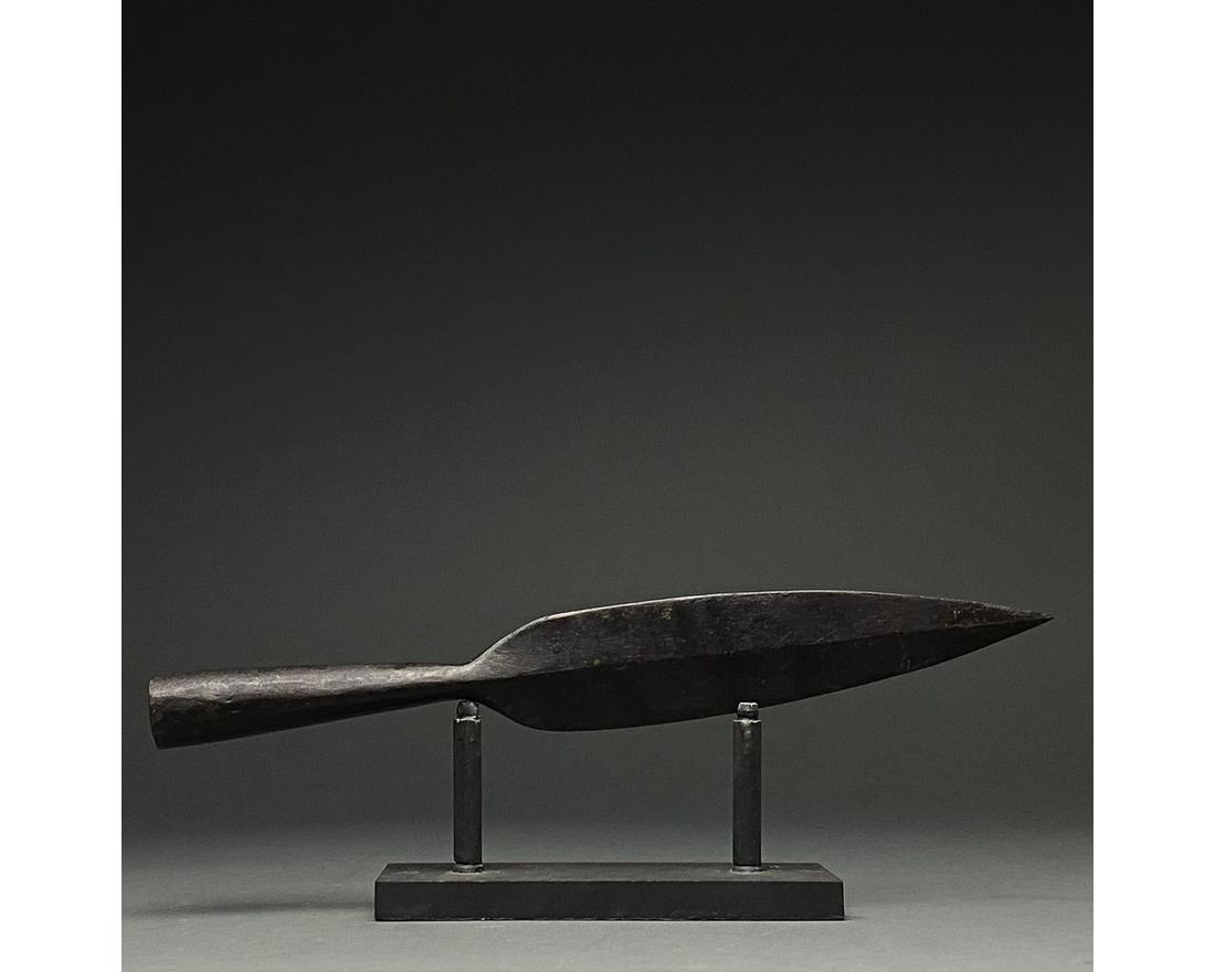 LARGE ROMAN IRON SOCKETED SPEAR HEAD: C. 300-500 AD Roman. An iron spearhead comprising a tapering leaf-shaped blade with a raised midrib and a long socket for increased control. Weapons of this type were used in the Late Roman period bot