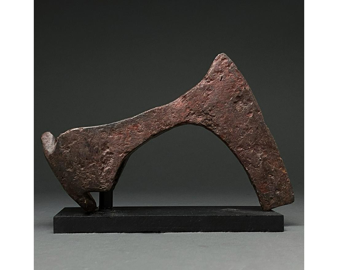 LARGE VIKING IRON BEARDED AXE HEAD: c. 900-1100 AD. Viking age. An iron bearded axe head with a heavy blade, narrow cheek, rounded socket and rectangular flanges. The bearded axe, or SkeggÃ¸x (from Old Norse Skegg, "beard", and Ã¸x,
