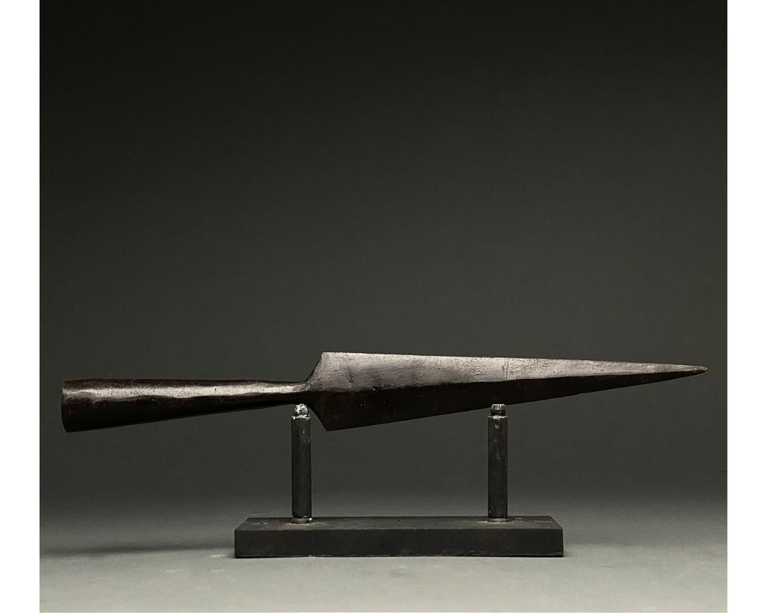 ROMAN IRON SOCKETED SPEAR HEAD: C. 300-500 AD Roman. An iron spearhead comprising a tapering triangular blade with a raised midrib and a long socket for increased control. Weapons of this type were used in the Late Roman period both