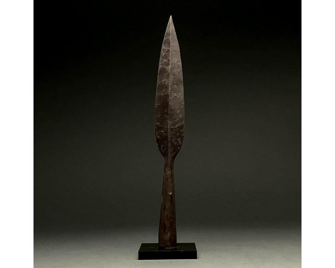 LARGE ROMAN IRON SOCKETED SPEAR HEAD: C. 300-500 AD Roman. An iron spearhead comprising a slender tapering leaf-shaped blade with a raised midrib and a long socket for increased control. Weapons of this type were used in the Late Roman pe