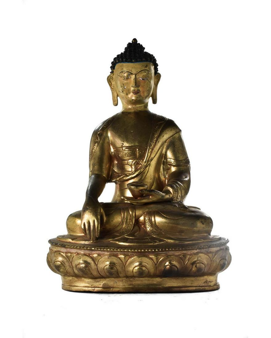 CHINESE BRONZE BUDDHA FIGURE WITH INLAID EYES: CHINESE BRONZE BUDDHA FIGURE WITH INLAID EYES. A fantastic bronze statuette of Buddha, depicted seated in meditation on a lotus base, wearing a lose robe and showing a peaceful face beautifully decora
