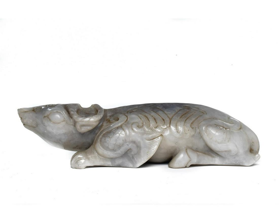 CHINESE JADE CARVED ANIMAL: An interesting and unusual jade figurine elaborately carved depicting a mythical beast. Size: L:45mm / W:195mm ; 705g Provenance: From United Kingdom / European estate collections and antique fairs; a