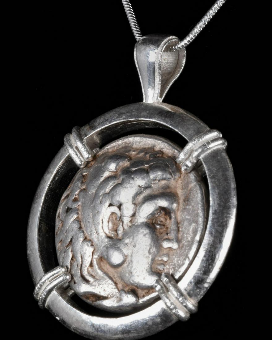 ALEXANDER THE GREAT SILVER TETRADRACHM IN SILVER: Ca. 323â€“300 BC. Hellenistic. A silver coin (tetradrachm) issued by Alexander III, also known as Alexander the Great, depicting Herakles in right profile on the obverse wearing the lion-head hea