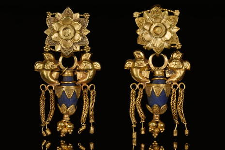 PAIR OF GREEK HELLENISTIC GOLD EARRINGS: Ca. 400-300 BCA fine matching pair of gold earrings; decorated with granulations and gold cains; two dolphines supporting an amphora shaped body; hooks decorated with floral patterns.Size: Set of 2;