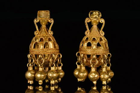 PAIR OF GREEK HELLENISTIC GOLD EARRINGS: Ca. 400-300 BCA fine matching pair of gold earrings; decorated with granulations and gold cains. Set of 2Size: L:45mm / W:35mm; 23.6gProvenance: Property of a London Gentleman; formerly in a private