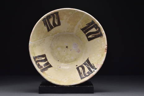 SAMANID PERIOD BLACK KUFIC ON WHITE TIN GLAZE SLIP: Nishapur, Ca. 10th century AD A nicely formed pottery bowl with its interior decorated with white tin glaze slip with black painted Kufic script. Nishapur was an ancient and medieval city in Iran,