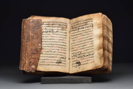 MEDICAL MANUSCRIPT INCLUDING TREATMENTS FOR SCABIES: Ottoman Empire, Ca. 17th century AD An Arabic Medical text, it includes treatments for scabies and improvements for sexual performance. In a beautiful, tooled leather container with roundel