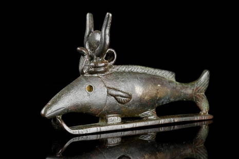 ANCIENT EGYPTIAN BRONZE OXYRHYNCHUS FISH: Late Period, Ca. 664 BC.A bronze figure of the god Oxyrynchus with the morphological characteristics of the animal which gives the god its name.Size: L:132mm / W:70mm; 285gProvenance: Private London c