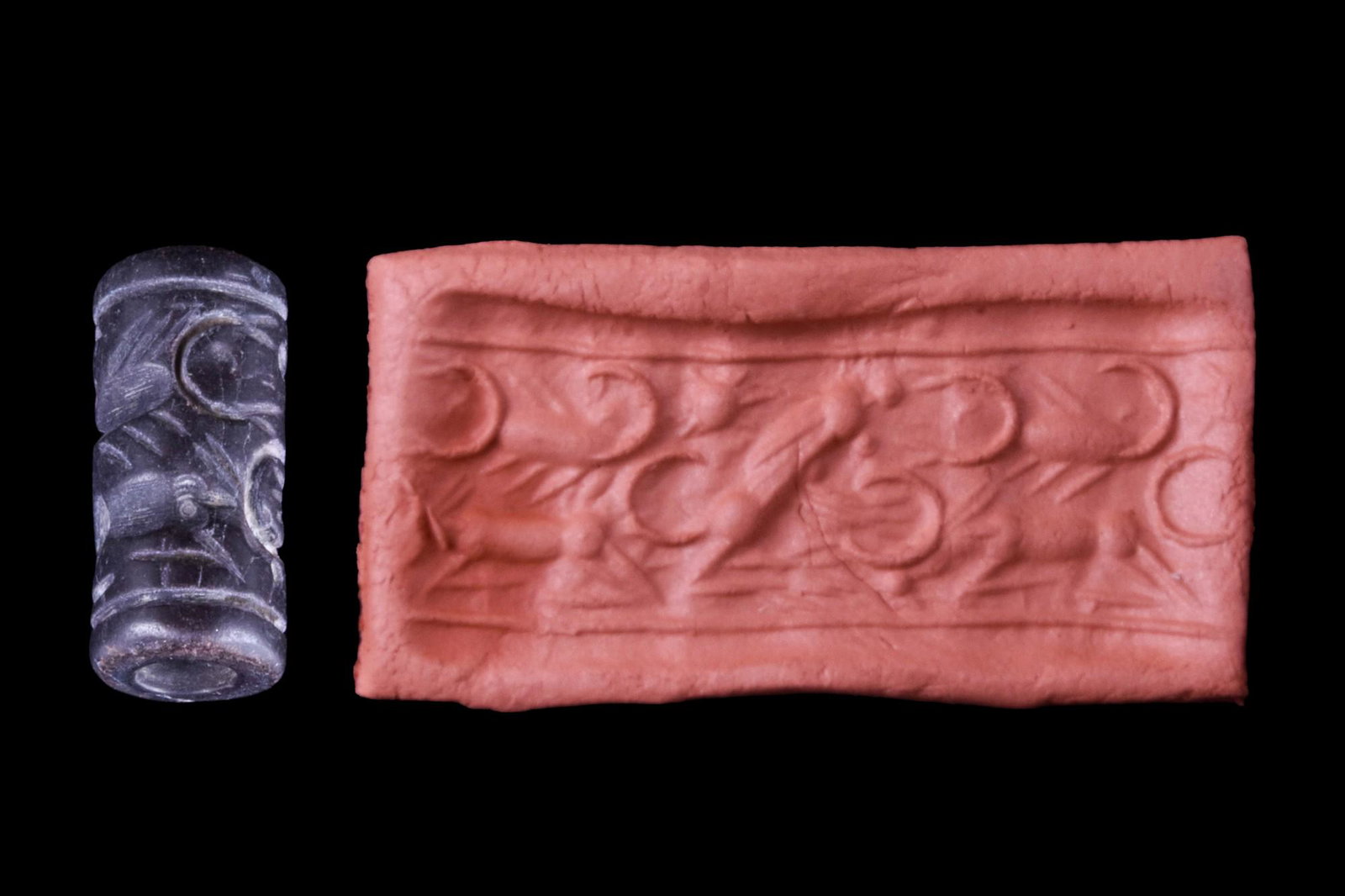 MITANNI HEMATITE CYLINDER SEAL WITH SCORPIONS - ORIGINAL LAMBERT REPORT: Ca. 1400-1100 BC.Cylinder seal of hematite. Two scorpions, rearing lion and solar disc, between rulings at top and bottom. Condition good. Accompanied by a signed scholarly note by Professor Wilfrid G