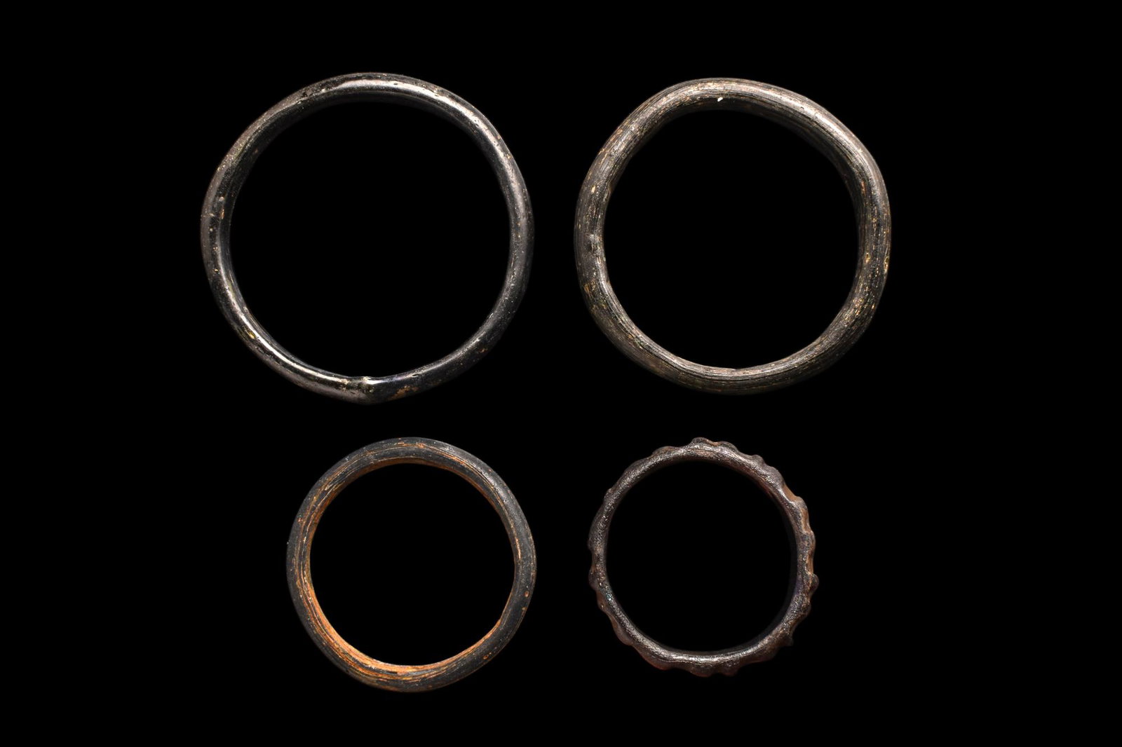 COLLECTION OF FOUR ROMAN GLASS BRACELETS (1 of 3)