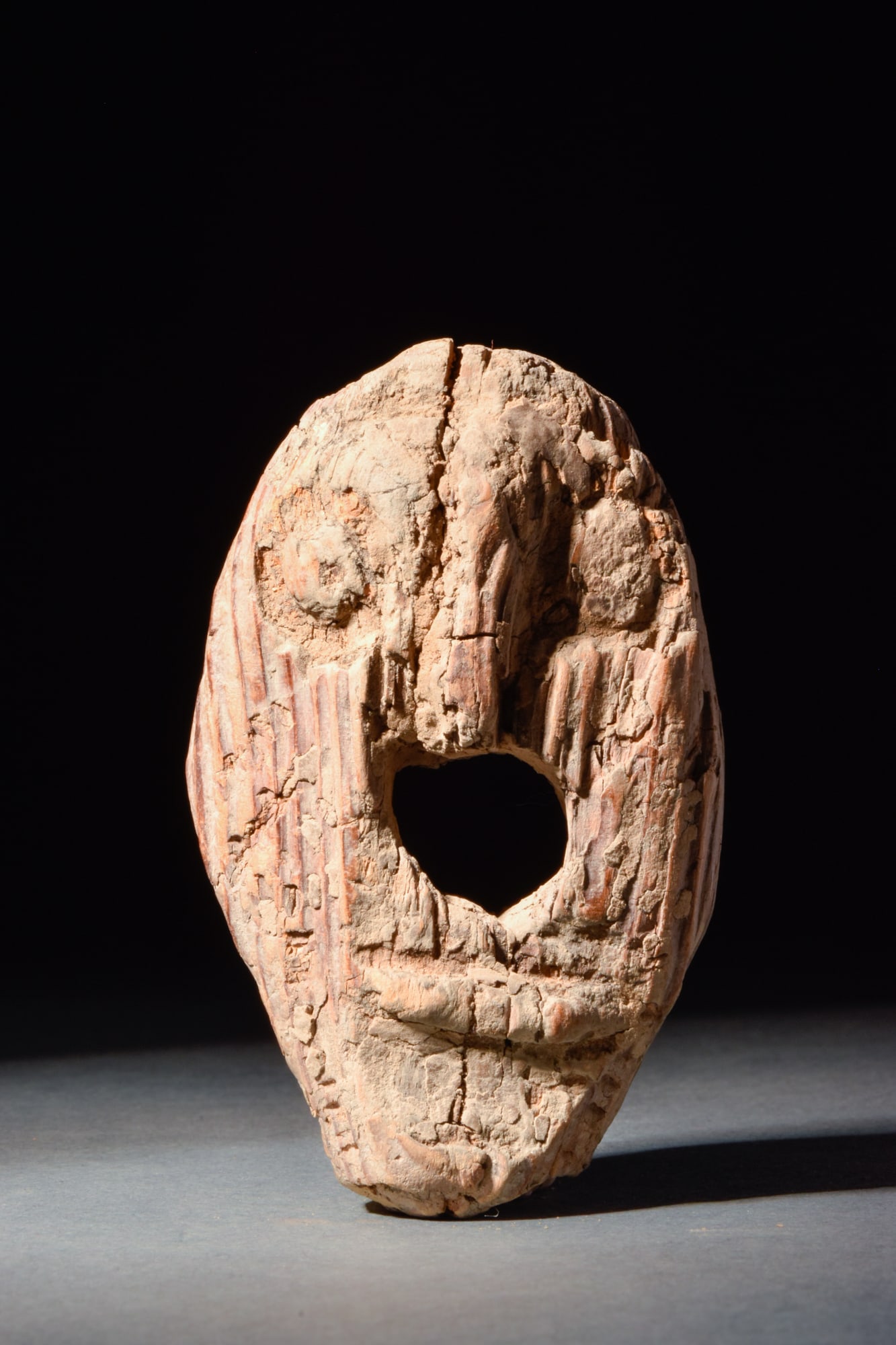 BALTIC VIKING WOODEN IDOL: Ca. 7th-8th Century AD.A wooden idol in the form of an anthropomorphic head, oval in shape, with accentuated eyes, a pronounced nose and a large hole in the middle serving as a mouth. Size: 70mm x 50m