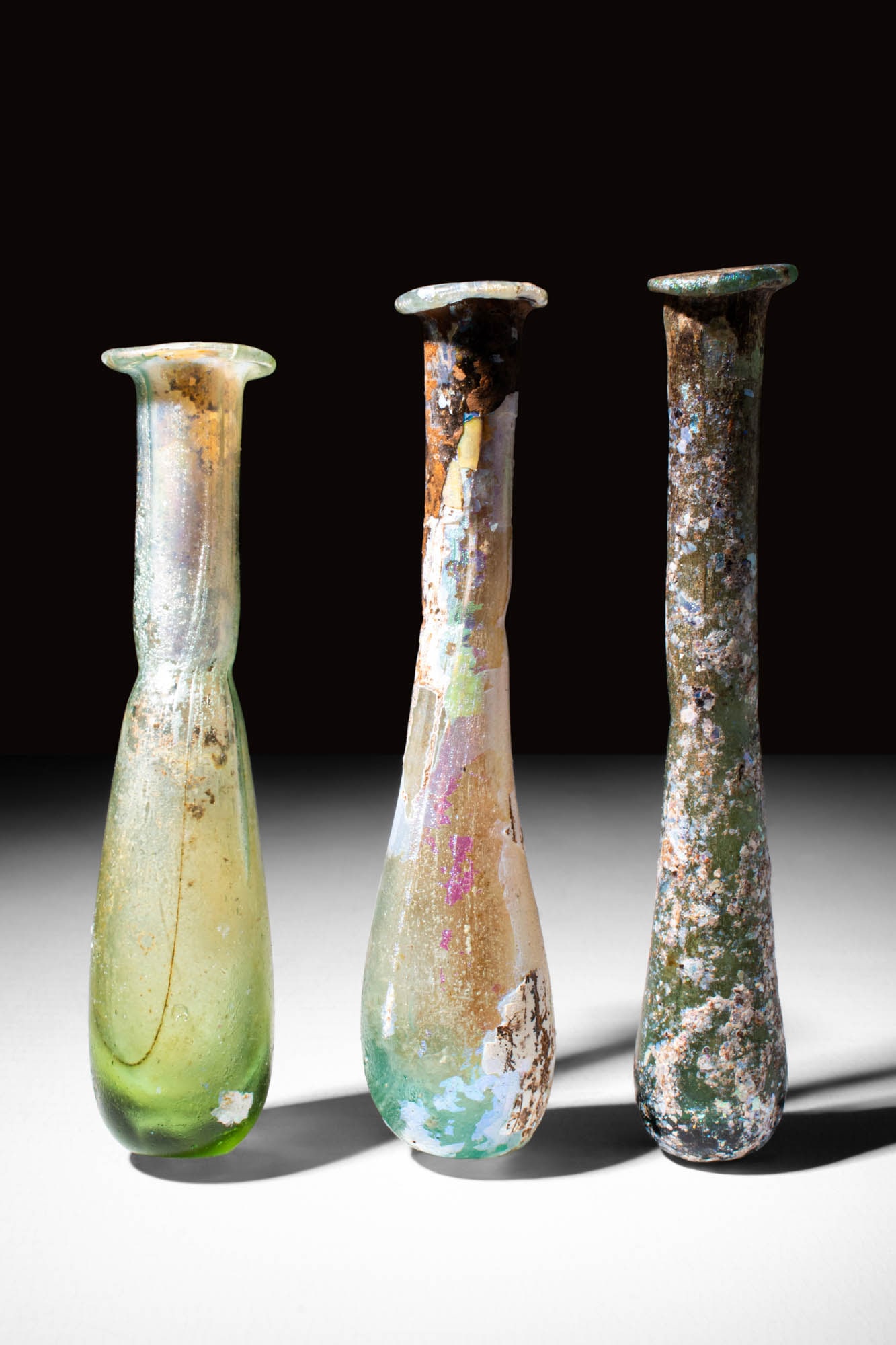 COLLECTION OF THREE ROMAN GLASS VESSELS (1 of 4)