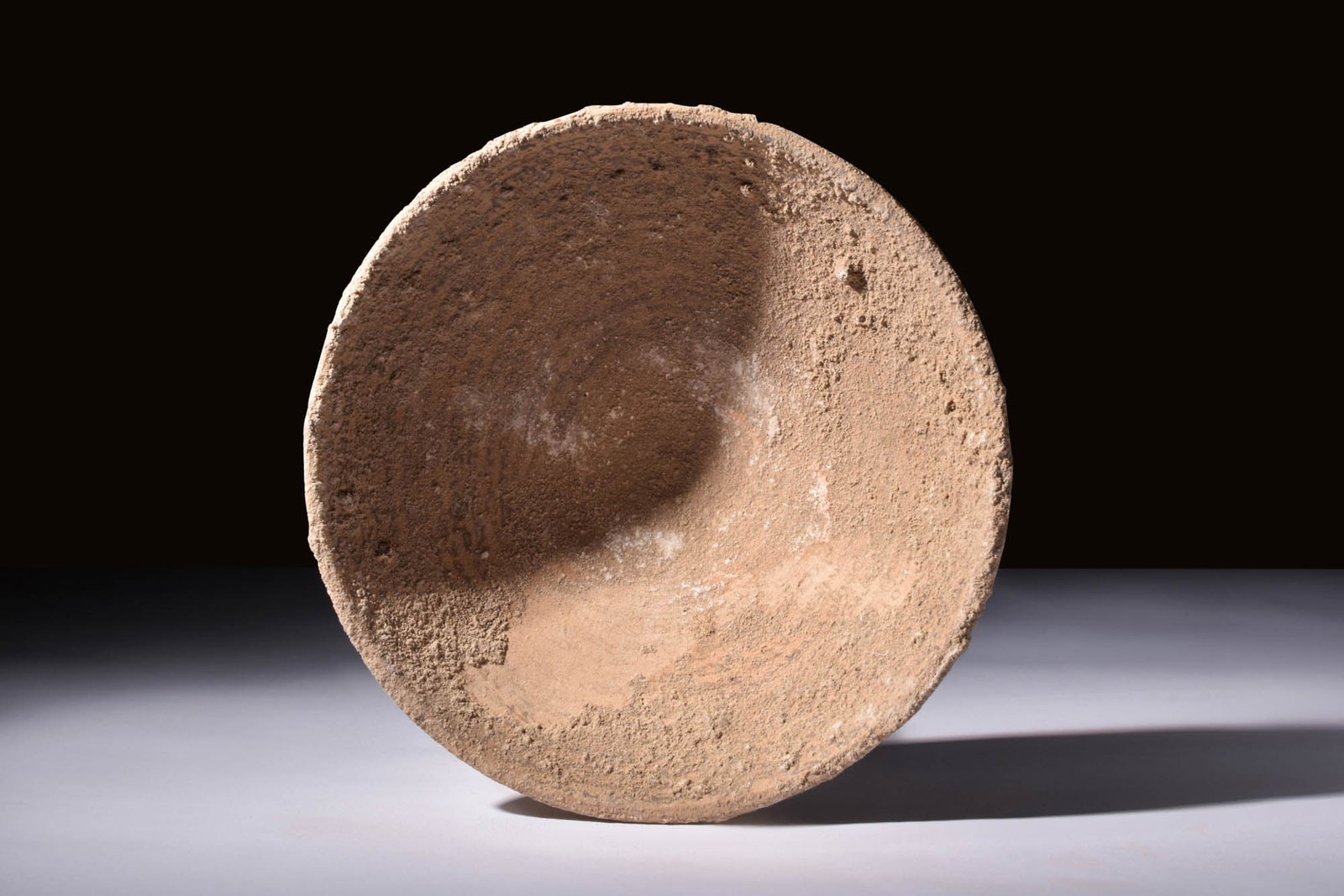 ARAMAIC POTTERY INCANTATION BOWL: Ca. AD 600 - 800.A pottery bowl adorned with intricately painted black lines of incantations against evil spirits. Incantation bowls such as this one are believed to have been used as a means of wardi