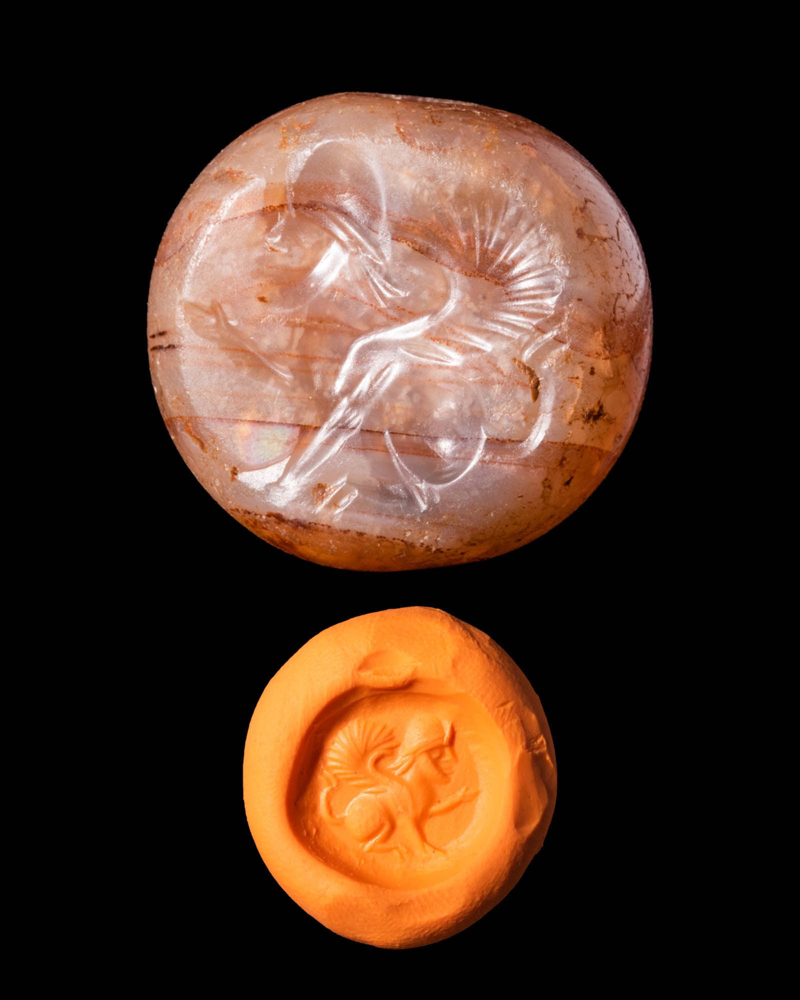 SASANIAN STAMP SEAL WITH LAMASSU: Ca. AD 200 - 400.A Sasanian stamp seal depicting a highly stylised lamassu with high wings facing left details. The seal has a globular body with a horizontally drilled hole. For similar see: Sasanian