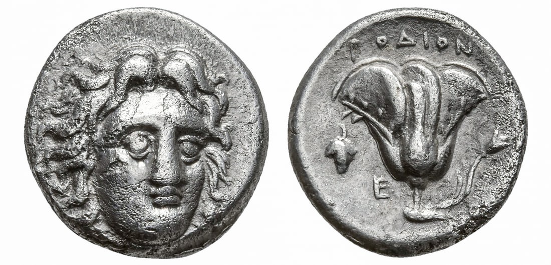 ISLANDS OF CARIA, RHODOS. RHODES. (CIRCA 305-275 BC). AR DIDRACHM: Ca. 305 - 275 BC Obv: Head of Helios facing slightly right Rev: Rose with bud to right; PO?ION above, E and grape bunch to left. Ashton 98; HN Online 813; HGC 6, 1433 Size: 19.1mm x 19mm; Weight: 6.52