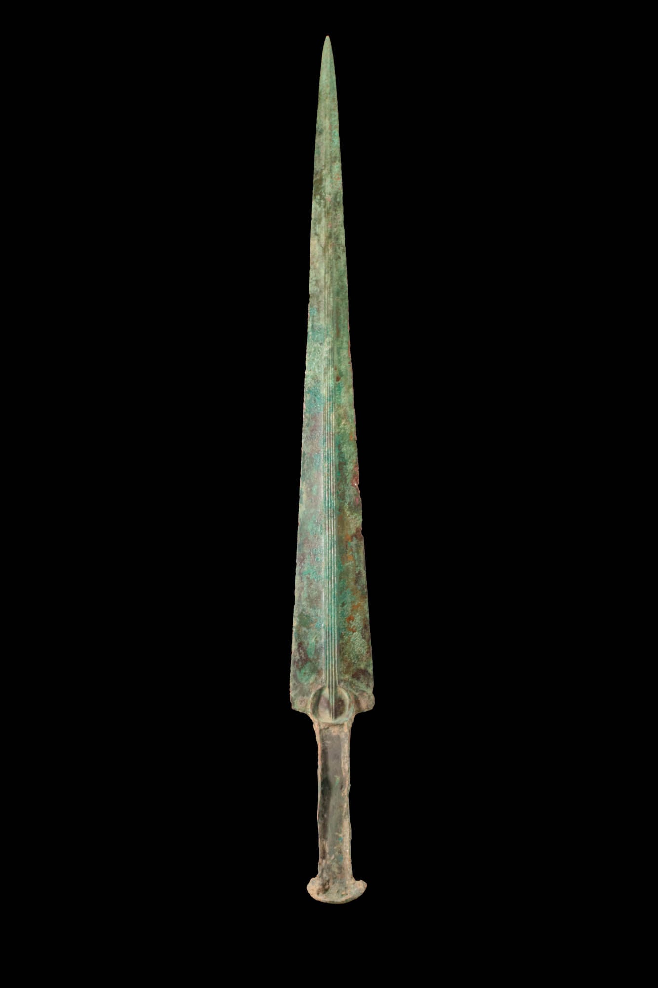 EARLY GREEK OR WESTERN ASIATIC BRONZE DAGGER: Ca. 1200 - 800 BC. An Early Greek or Western Asiatic moulded bronze dagger with a short, tapering blade, a prominent mid-rib composed of five lines and a guard. The hilt is characterised by a flat hol