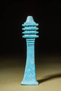 EGYPTIAN BLUE FAIENCE AMULET DJED PILLAR: New Kingdom, Ca. 1550 - 1069 BC.An exemplary mould-formed pendant in the form of a djed pillar. A djed pillar is characterised as a sizable structure with a gently flared base, a tiered upper section