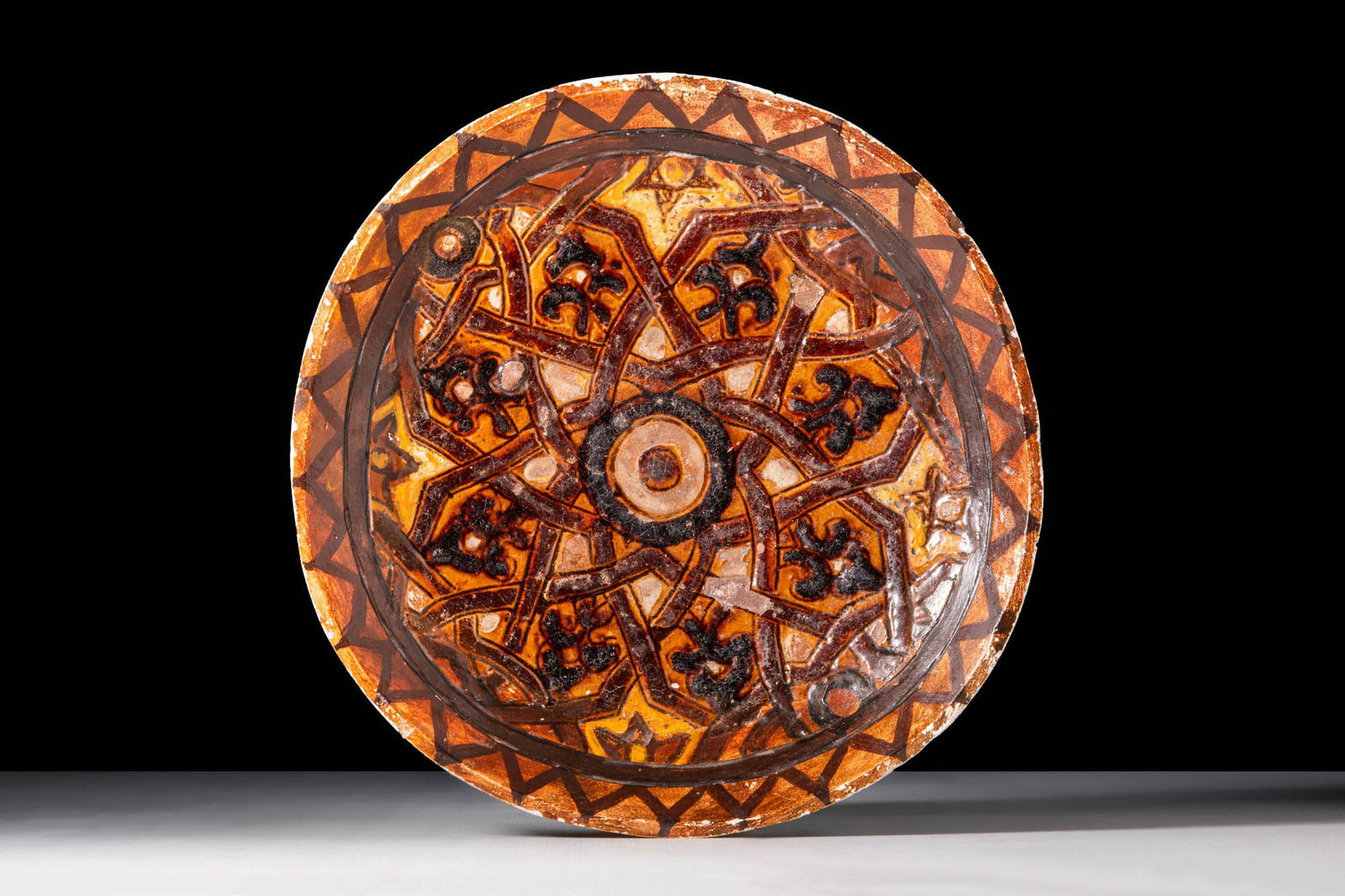 A MAMLUK SGRAFFITO DISH WITH FLOWERS
