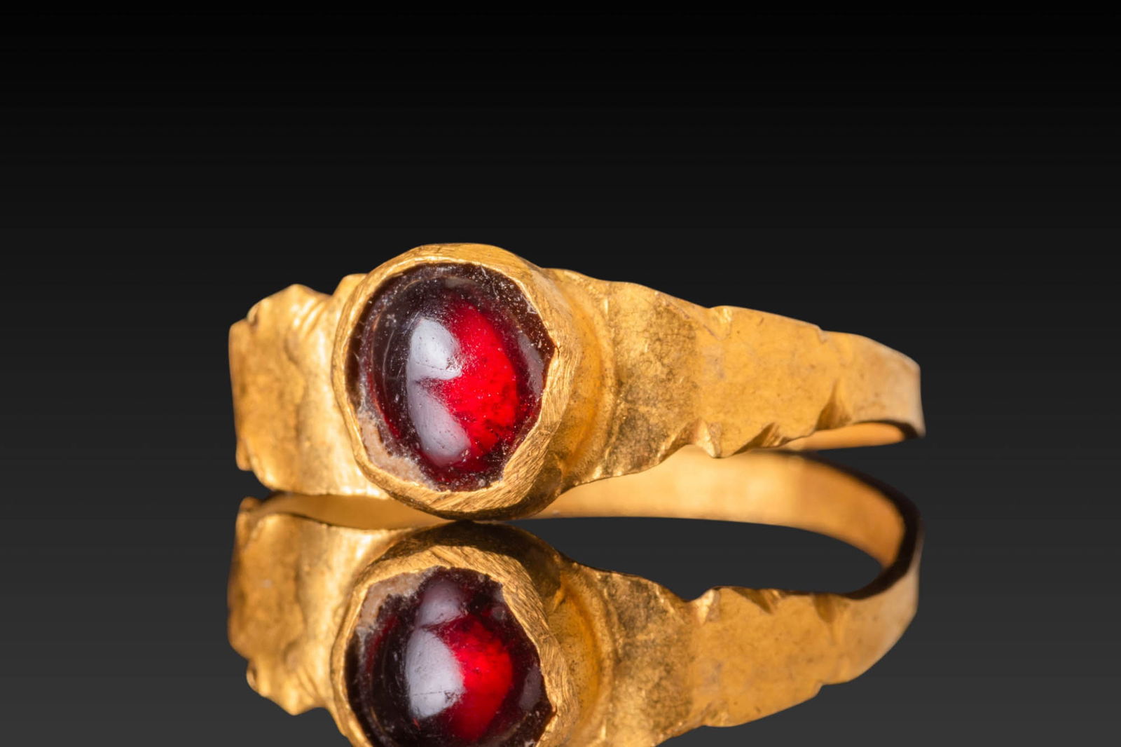 MEROVINGIAN HIGH KARAT GOLD RING WITH RED GARNET CABOCHON (1 of 3)
