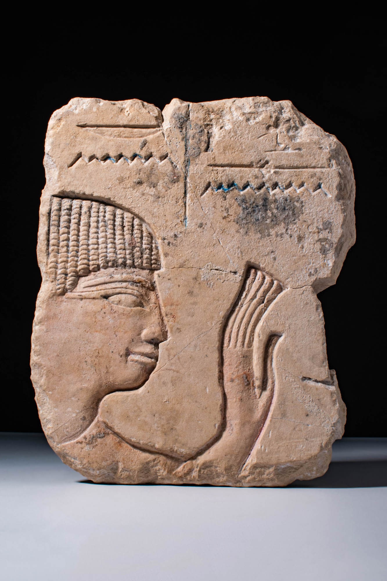 EGYPTIAN LIMESTONE RELIEF DEPICTING A WORSHIPPER